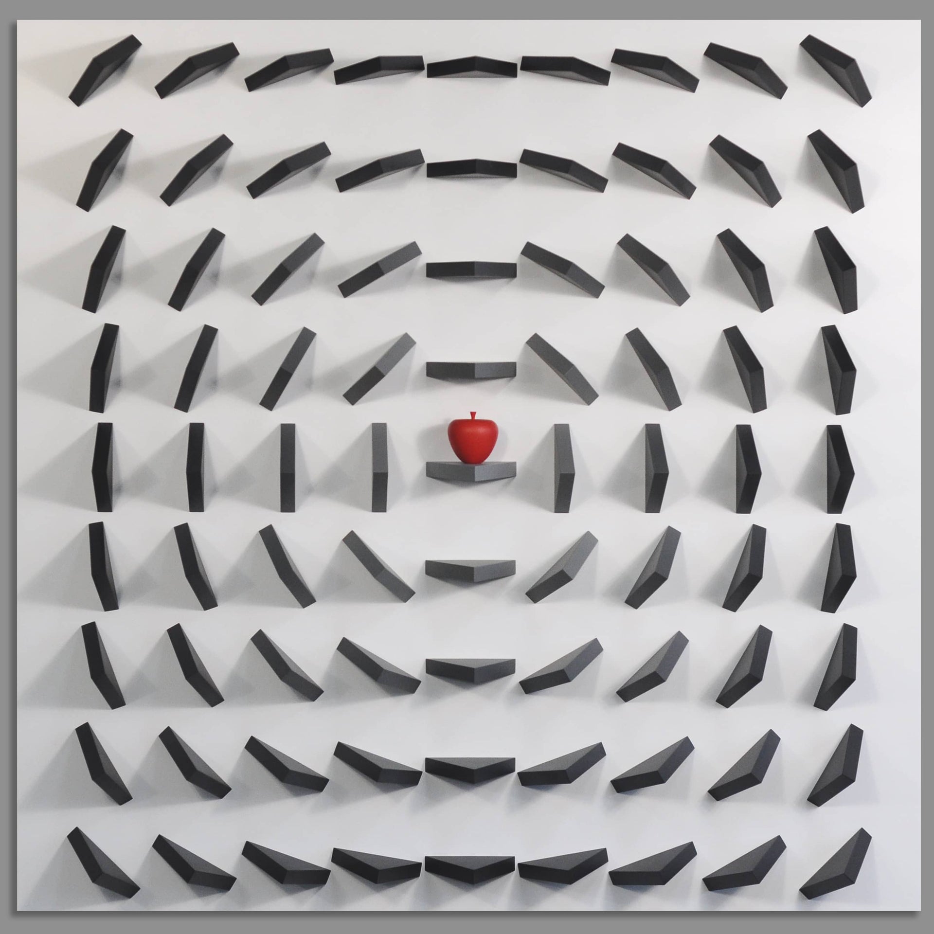 Maze-like pattern with a red apple at the center on a gray background