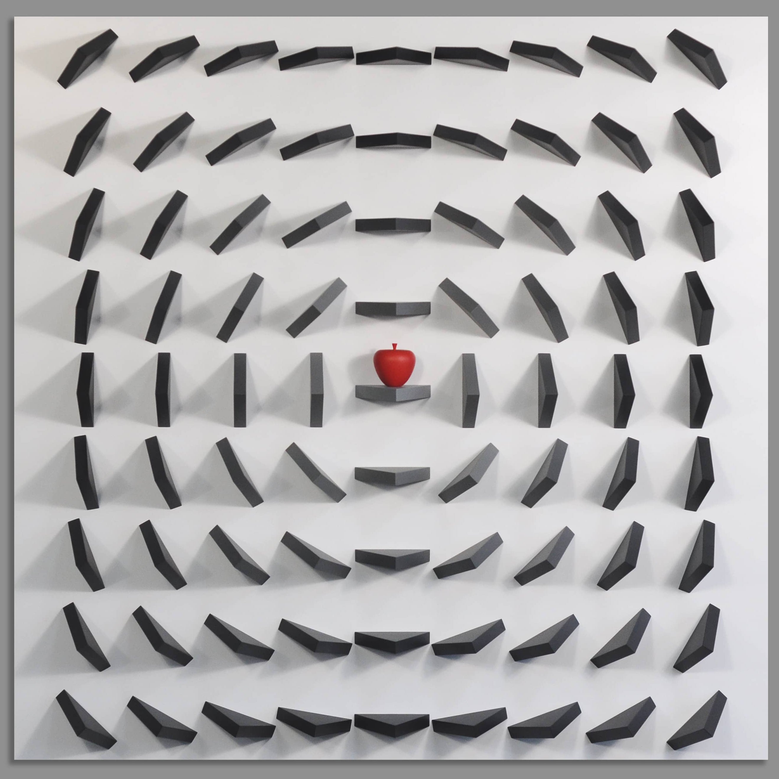 Maze-like pattern with a red apple at the center on a gray background