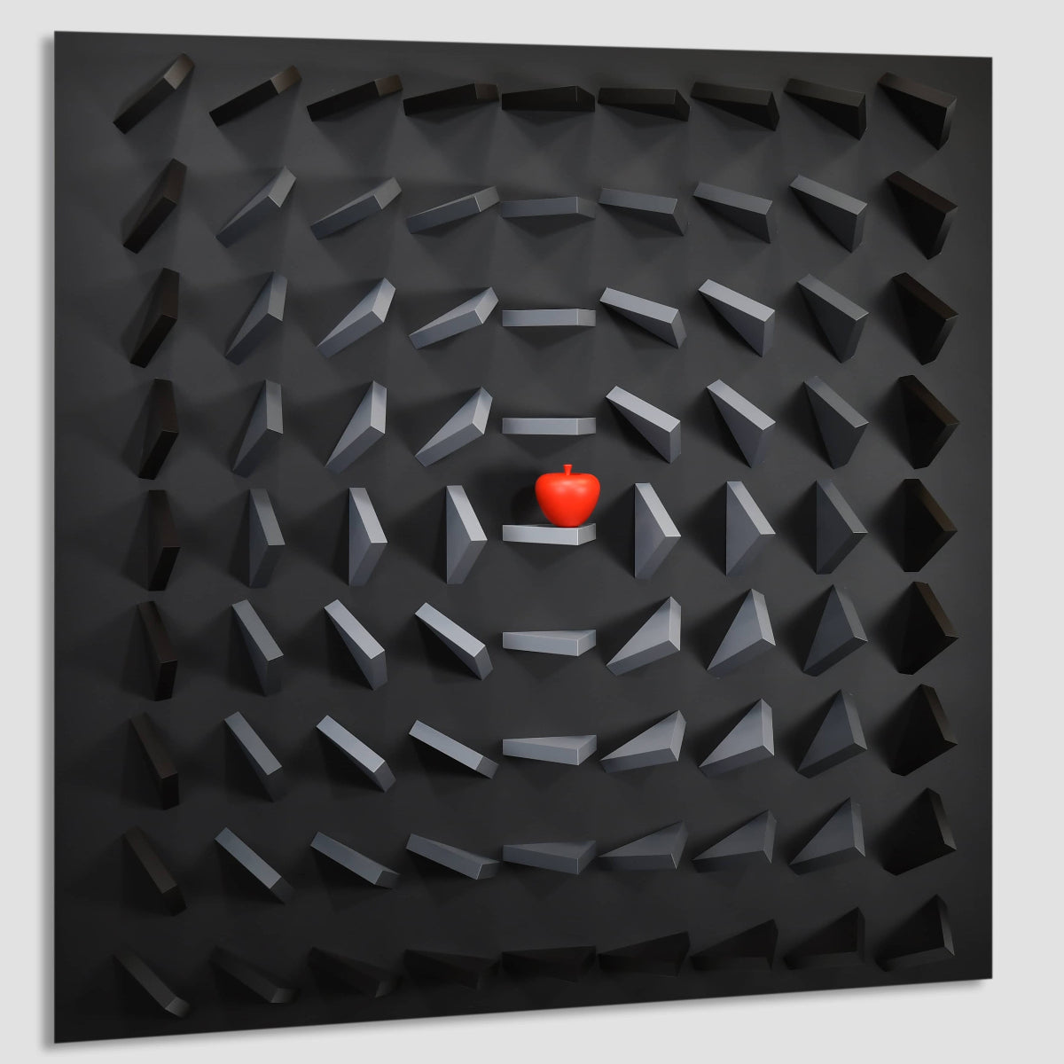 Black textured wall art with a red apple in the center on a light gray background