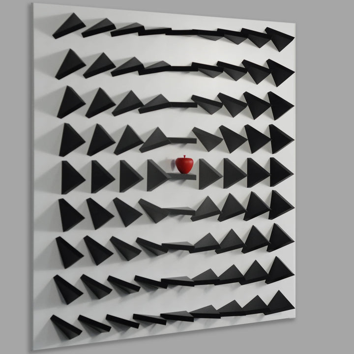 Abstract wall art with black geometric shapes on a gray background