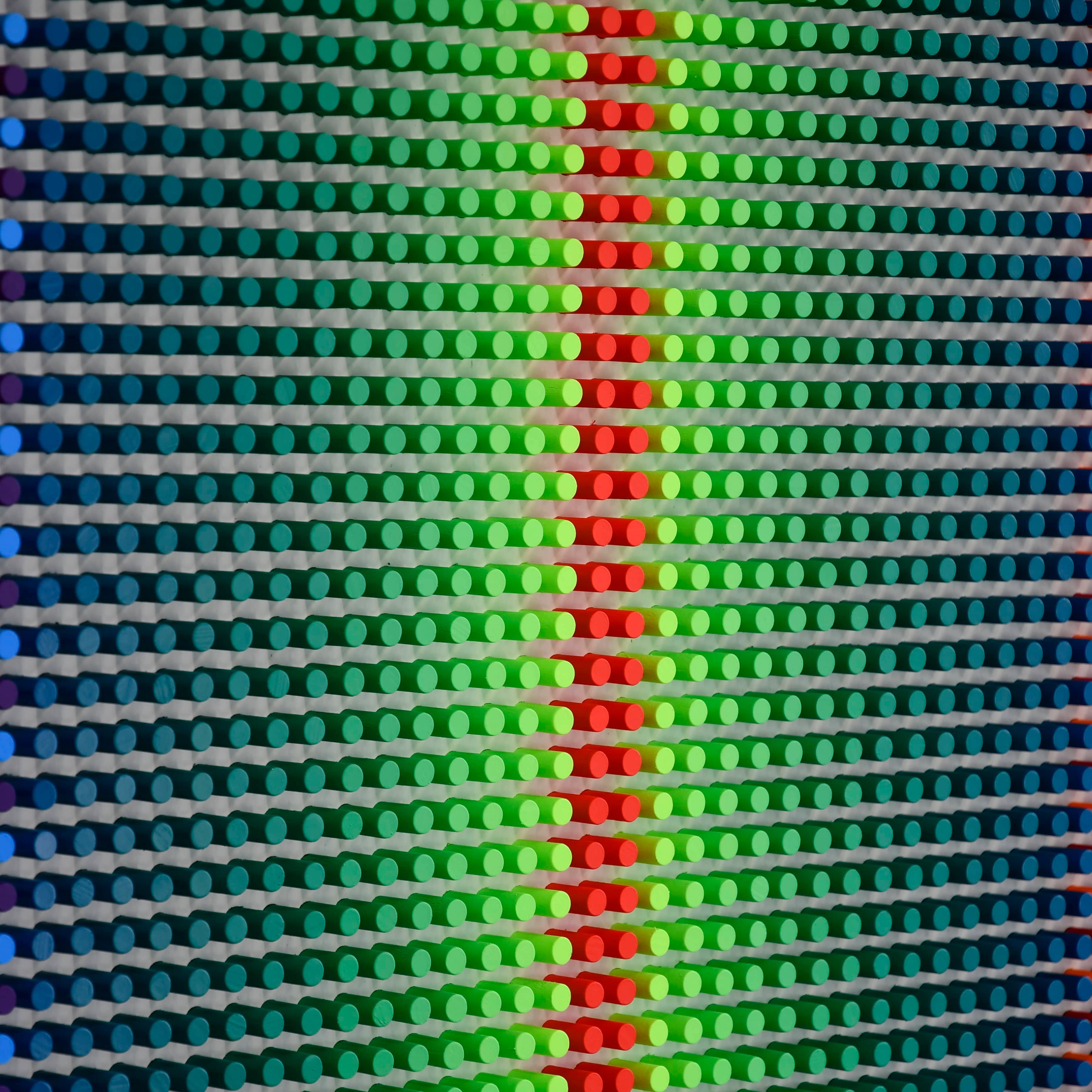 Colorful pattern made of interlocking bricks in various colors.
