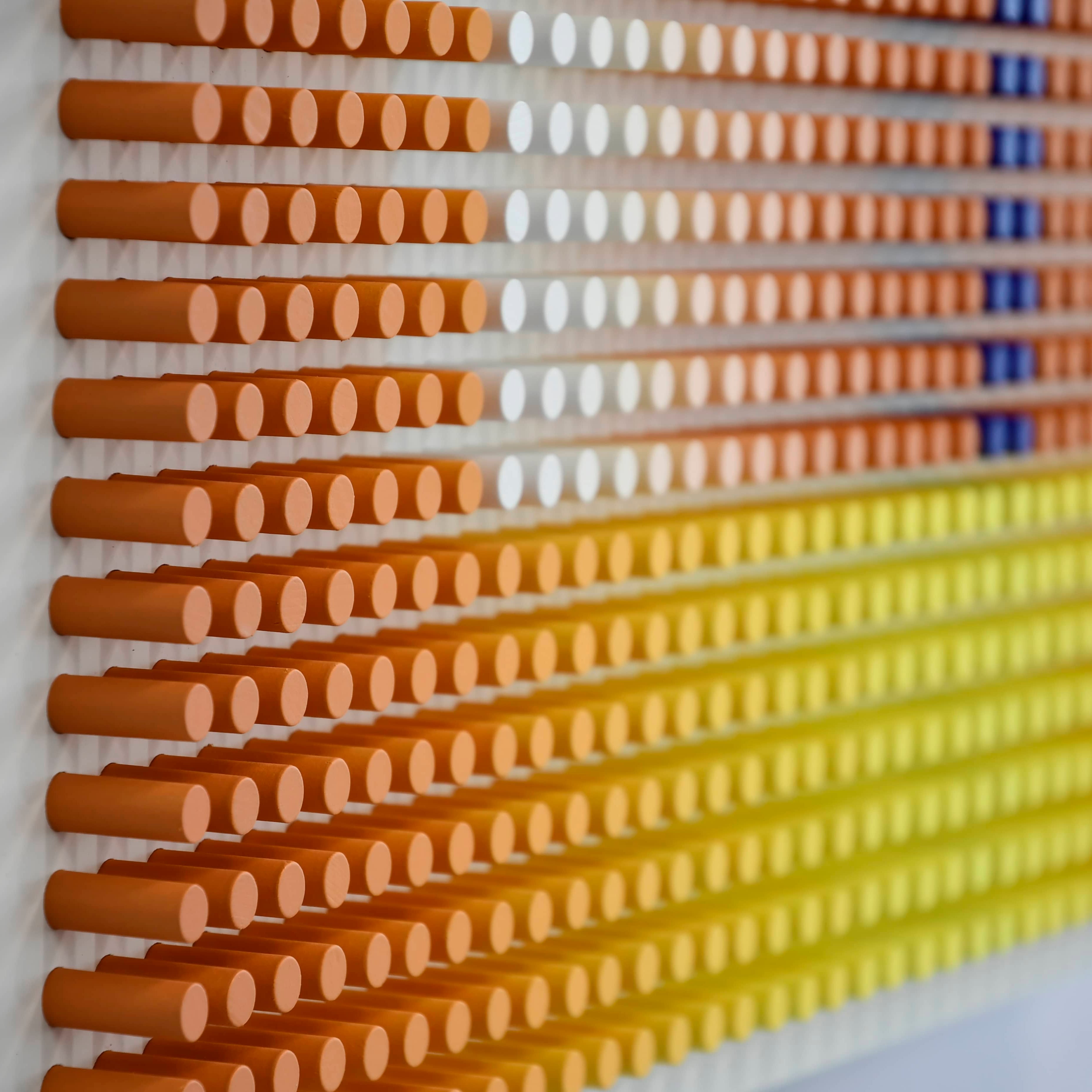 Color swatch chart with gradient shades of brown, orange, yellow, and blue on a white background.