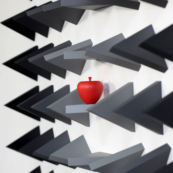 Red apple surrounded by black and gray arrows on a white background